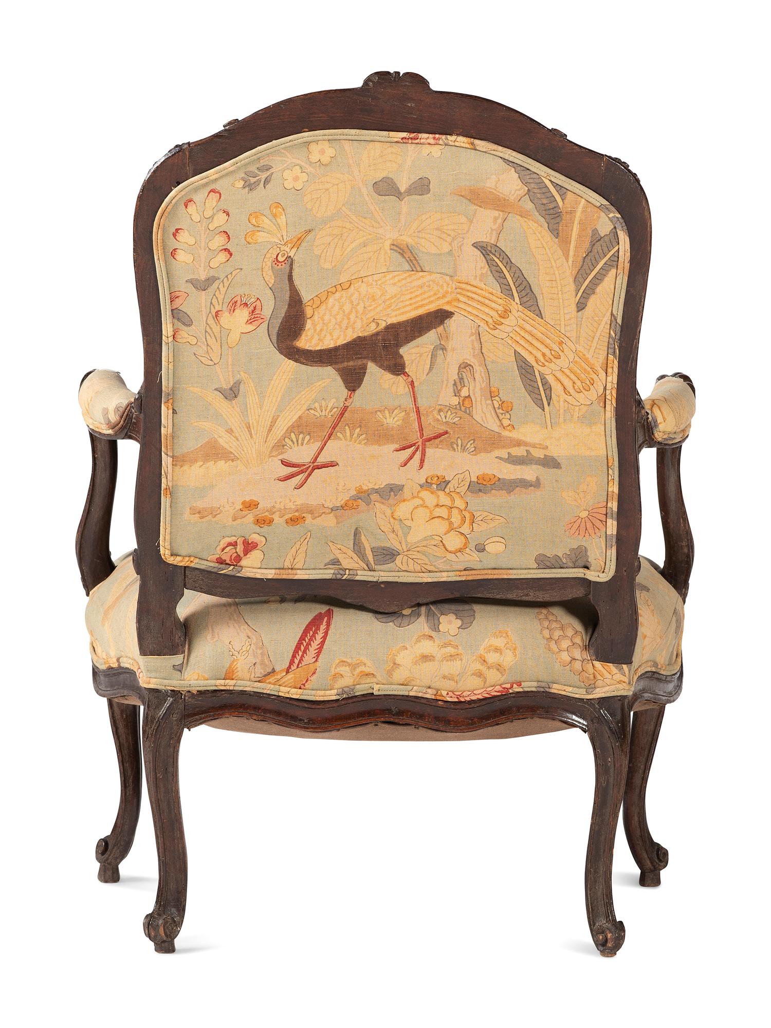 A Louis XV Carved Walnut Upholstered Fauteuil