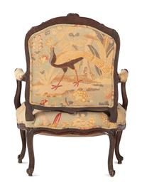 A Louis XV Carved Walnut Upholstered Fauteuil