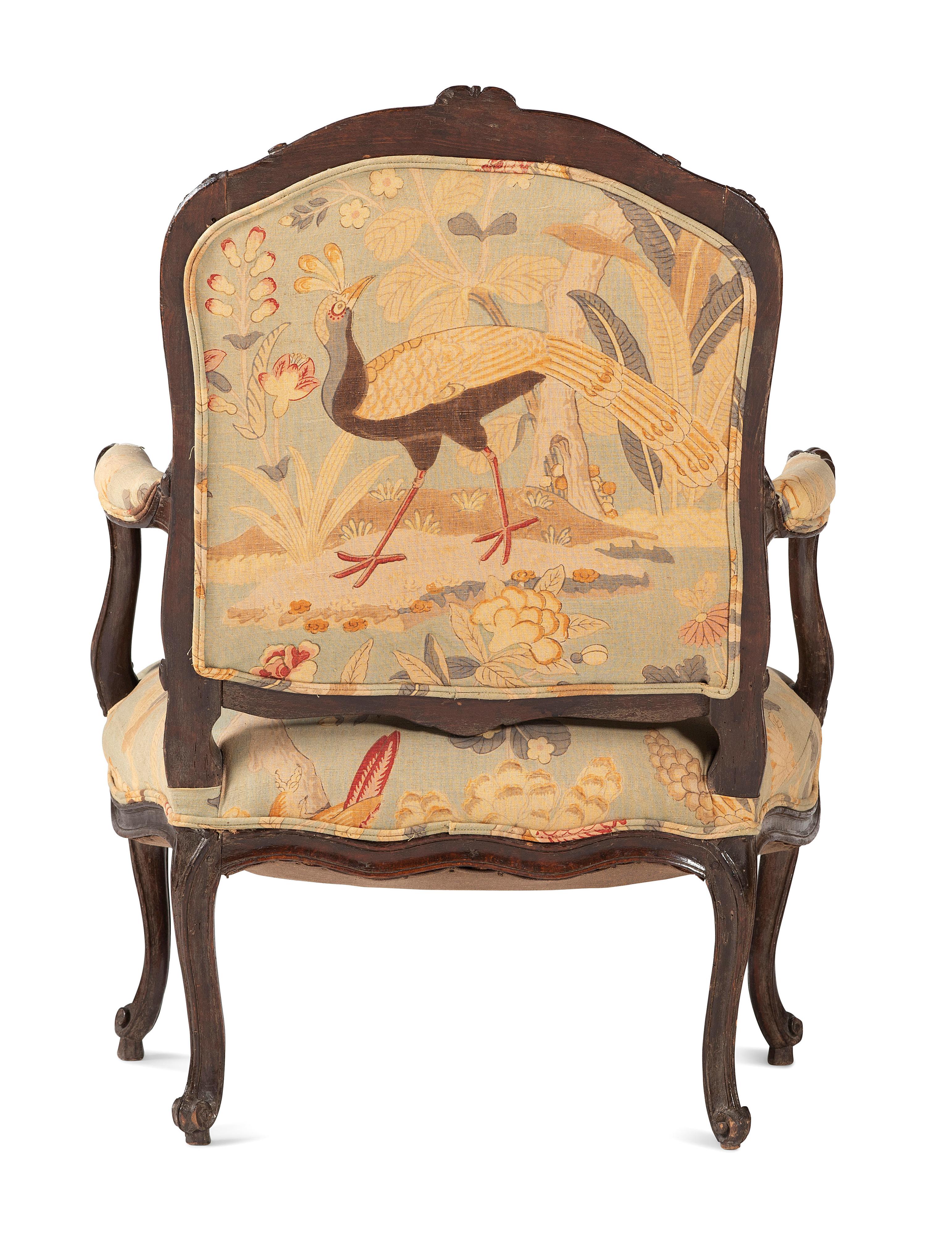 A Louis XV Carved Walnut Upholstered Fauteuil
