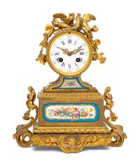 A French Gilt Metal and Porcelain Clock
