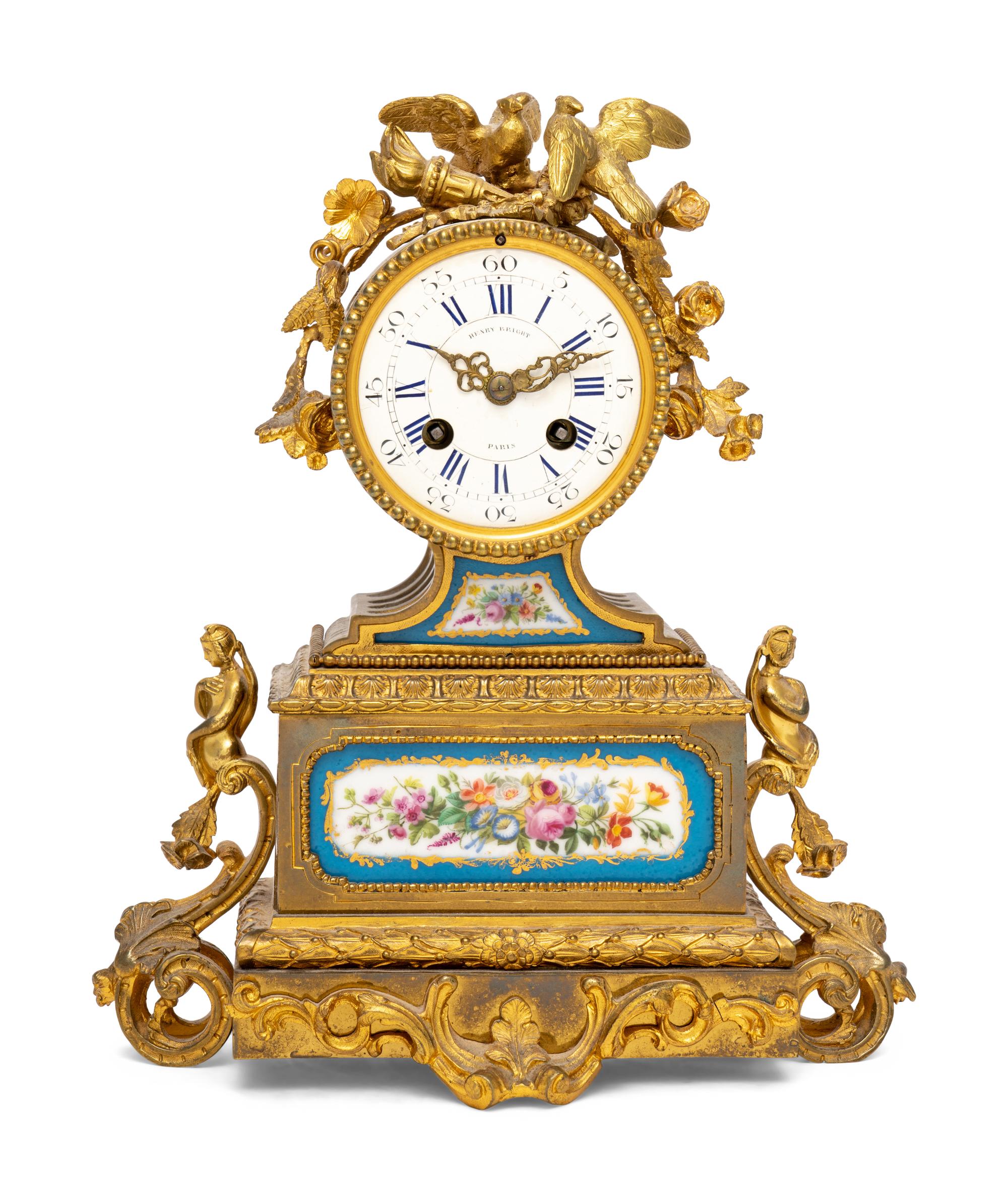 A French Gilt Metal and Porcelain Clock