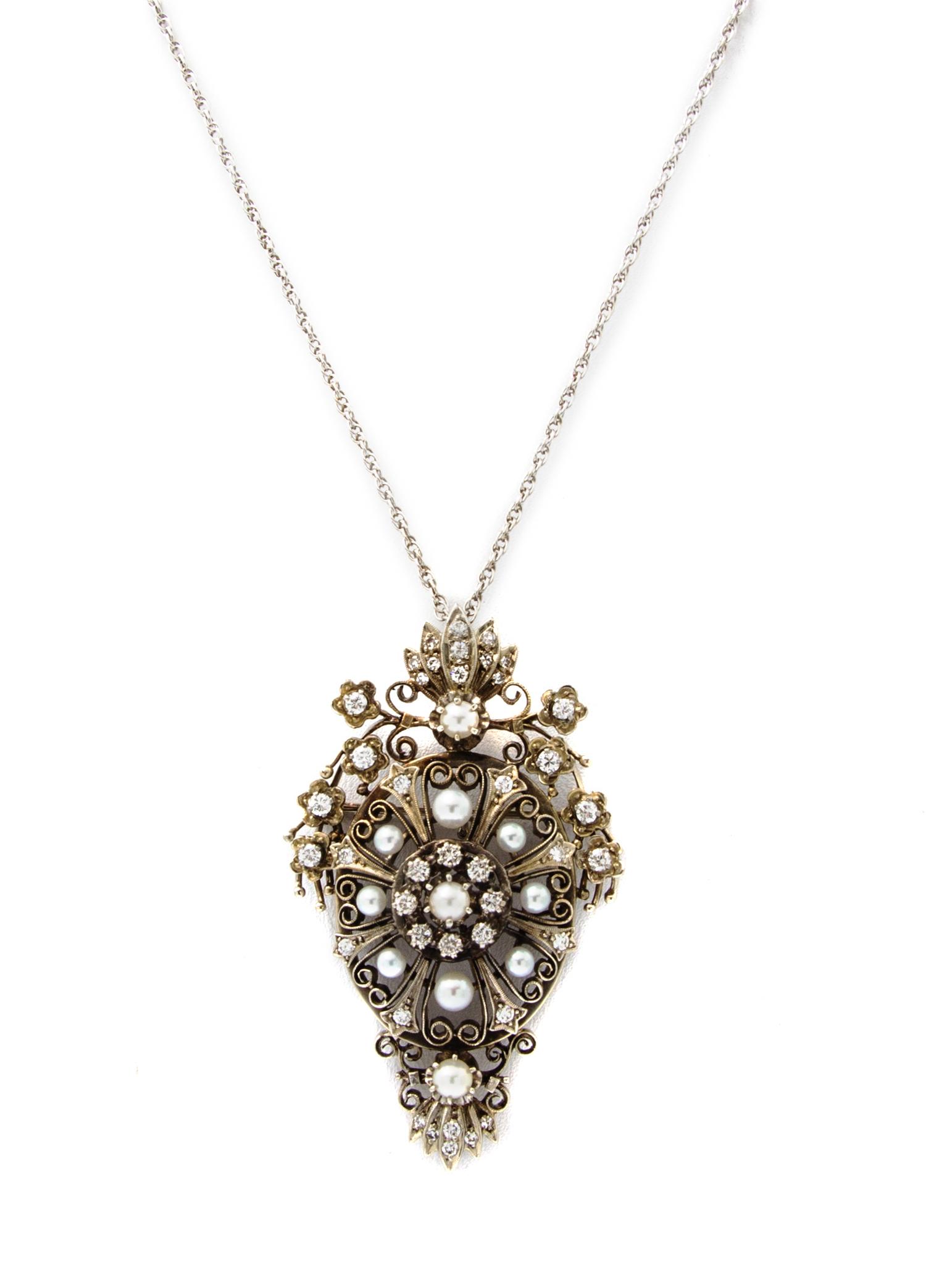 A White Gold, Diamond and Cultured Pearl Pendant/Brooch, 12.40 dwts.