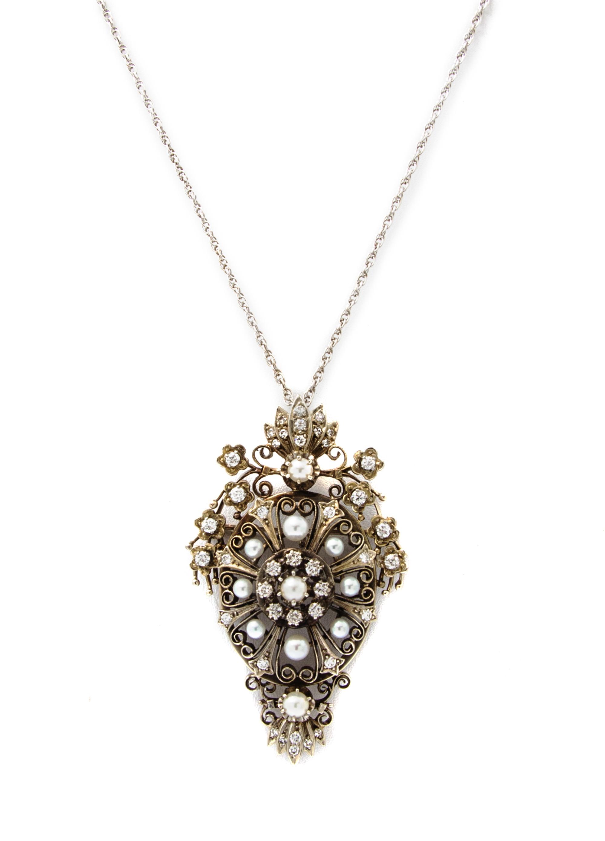 A White Gold, Diamond and Cultured Pearl Pendant/Brooch, 12.40 dwts.