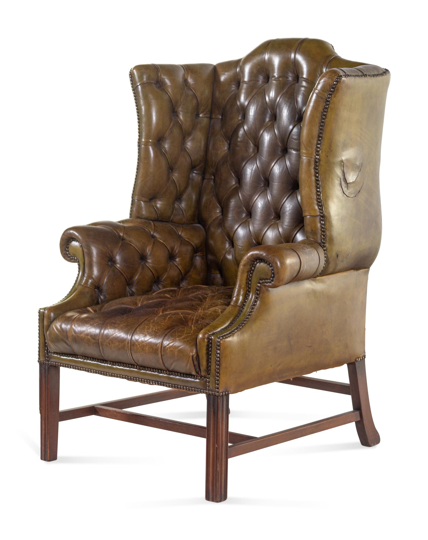 An English Leather Upholstered Mahogany Wingback Armchair