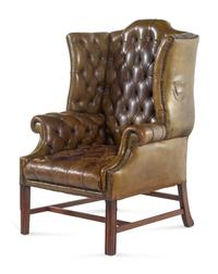 An English Leather Upholstered Mahogany Wingback Armchair