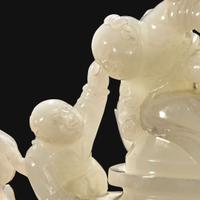 A Chinese carved white jade "Boys" vase and cover Qing Dynasty, 18th/early 19th Century
