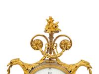 A Louis XVI Gilt Bronze and Marble Mantel Clock