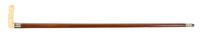 A Japanese Carved Ivory Cane Handle, Height overall 32 1/2 x width of handle 4 inches.