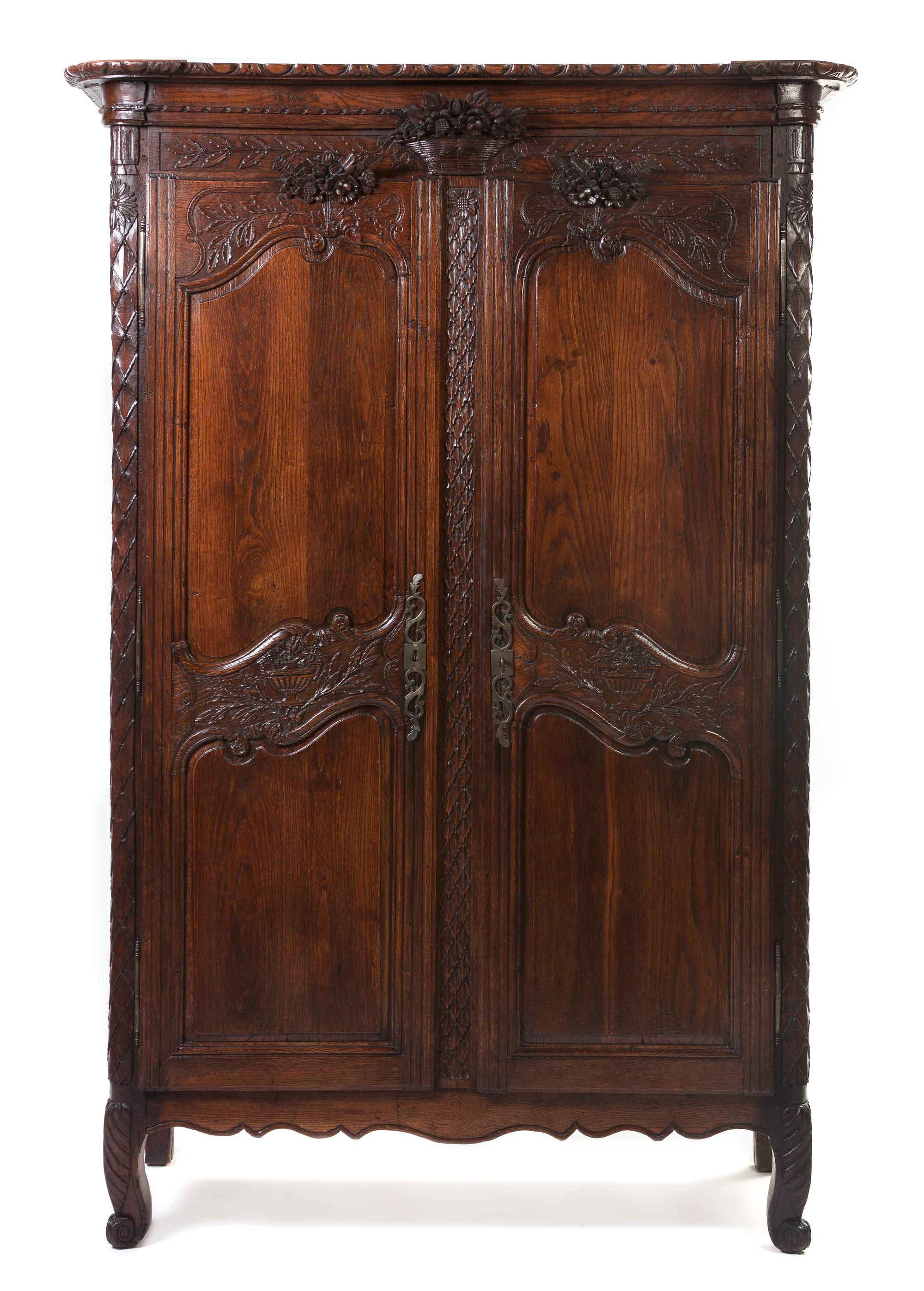 A French Provincial Oak Armoire, Height 83 1/2 x width 56 x depth 21 1/2 inches.
