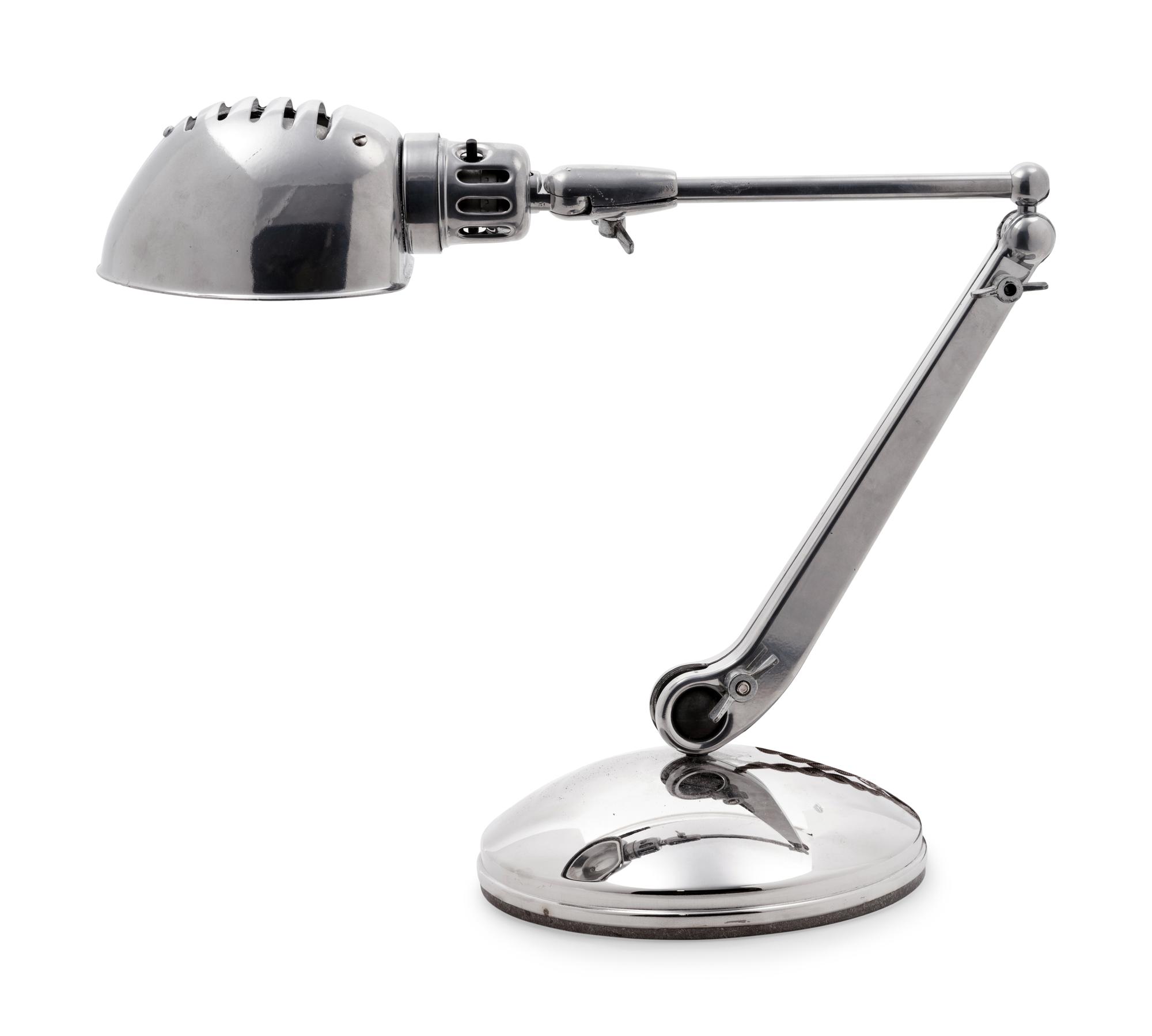 A Chromed Metal Articulated Desk Lamp