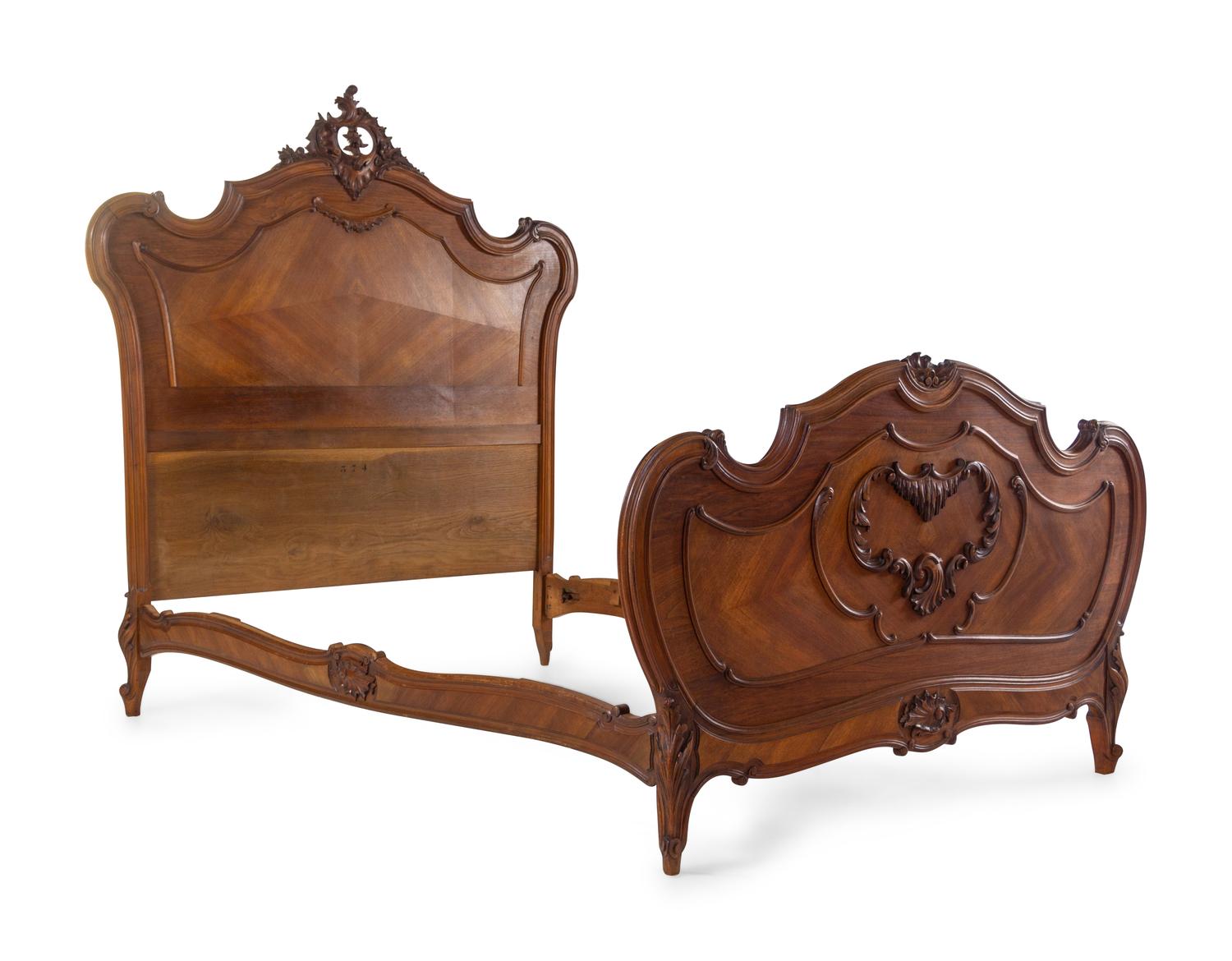 A Louis XV Style Walnut Bed