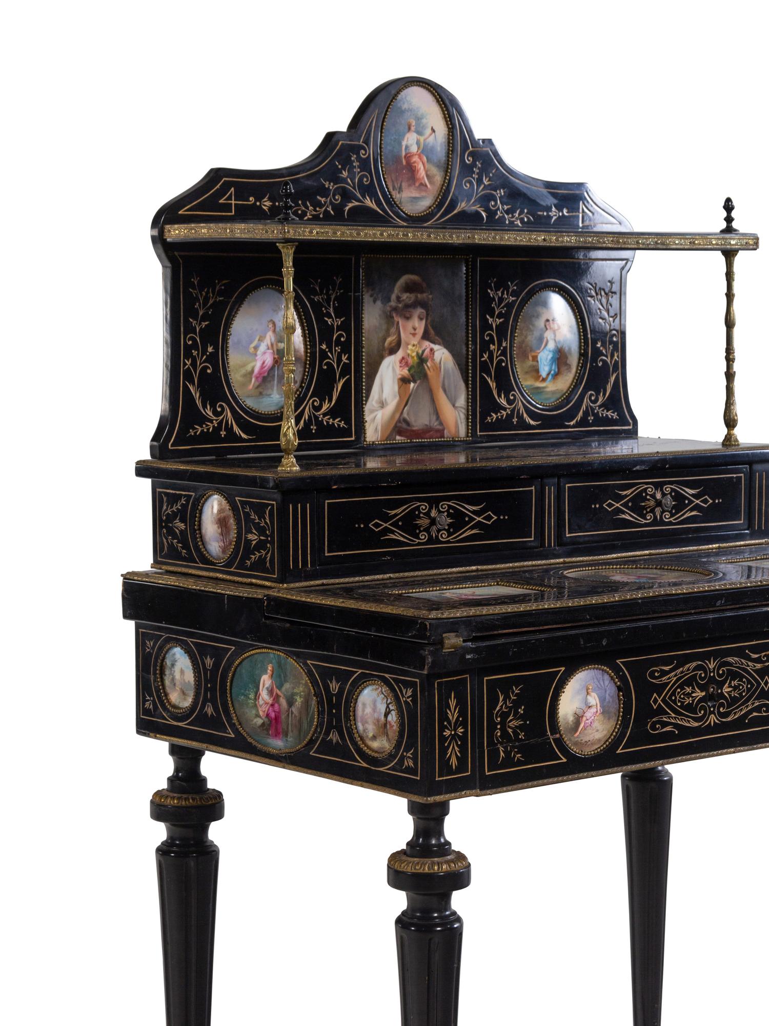 A Napoleon III Porcelain Mounted Ebonized Bonheur du Jour