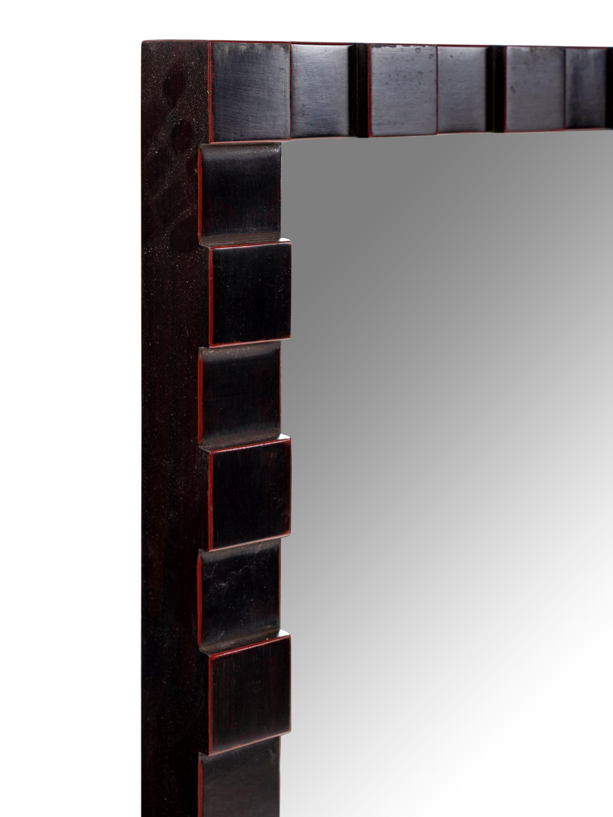 A Contemporary Carved Mahogany Mirror