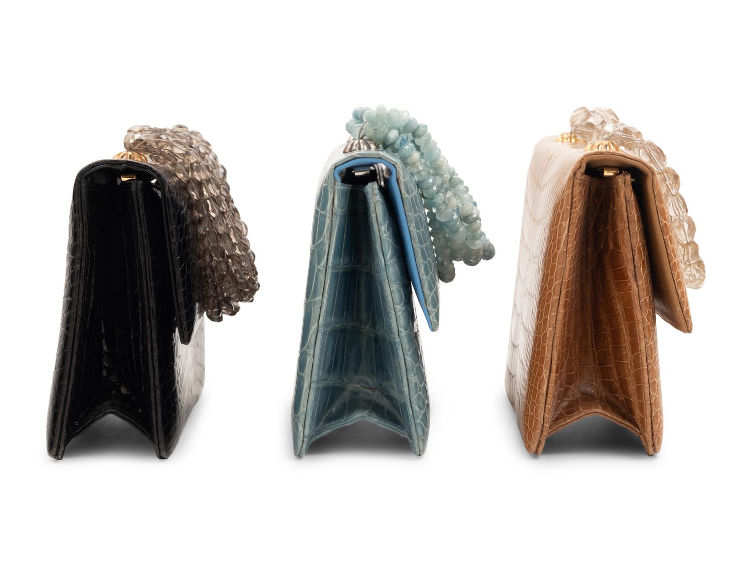 Three Darby Scott Alligator Flap Bags with Stone Handles: One Black, One Tan, One Blue