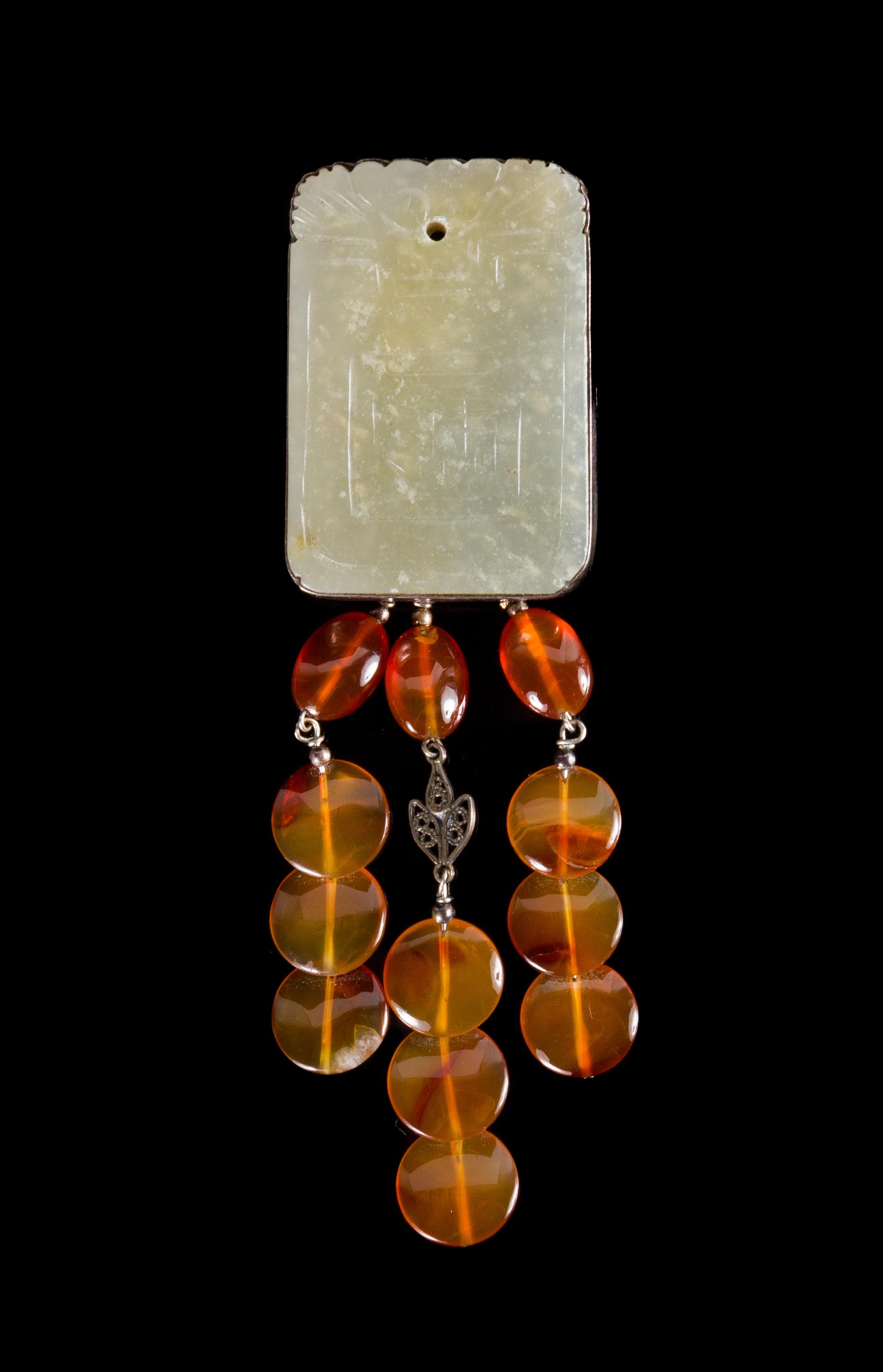 A Celadon Jade Plaque Height 1 7/8 inches. — 19TH CENTURY