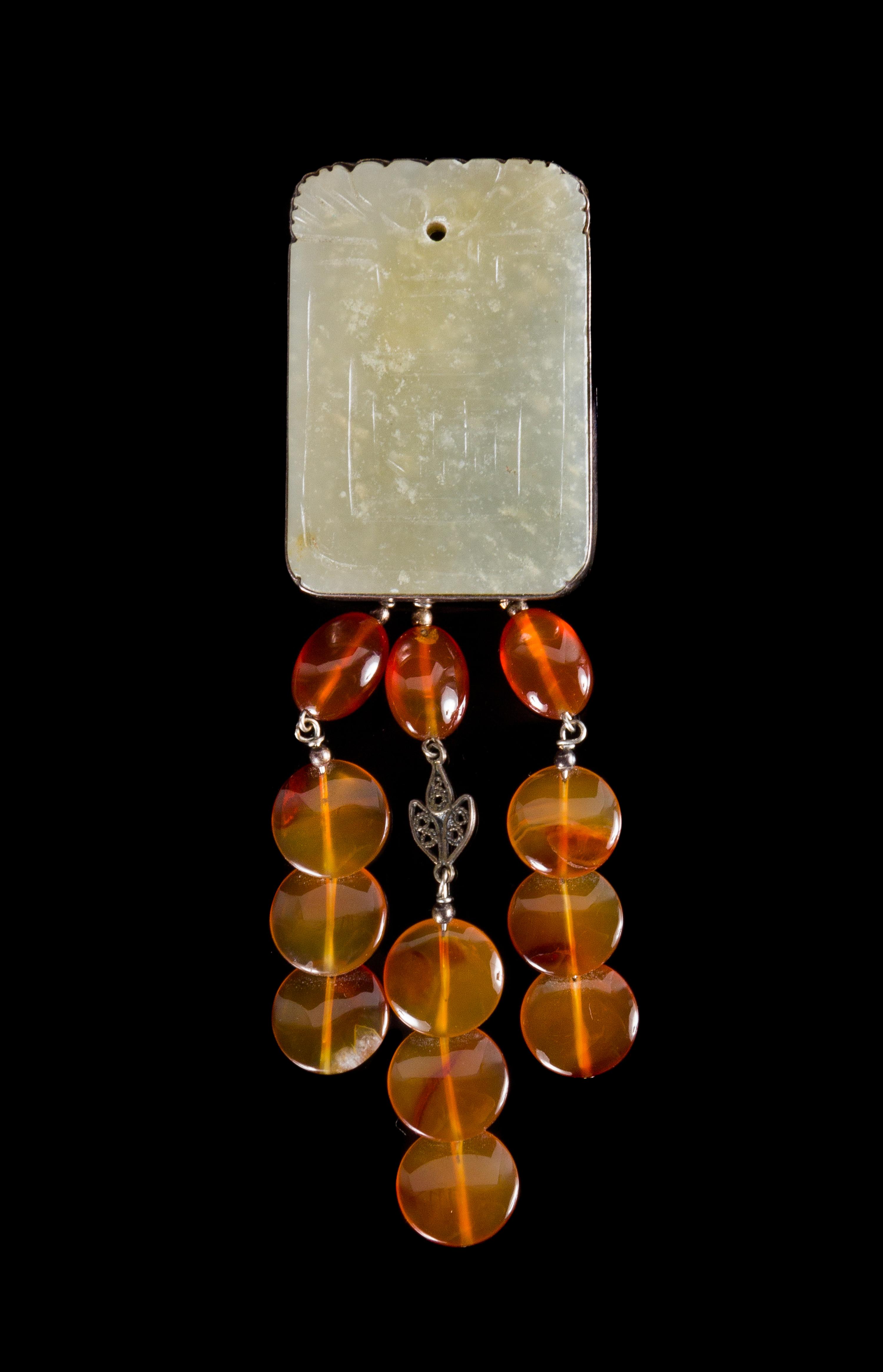 A Celadon Jade Plaque Height 1 7/8 inches. — 19TH CENTURY