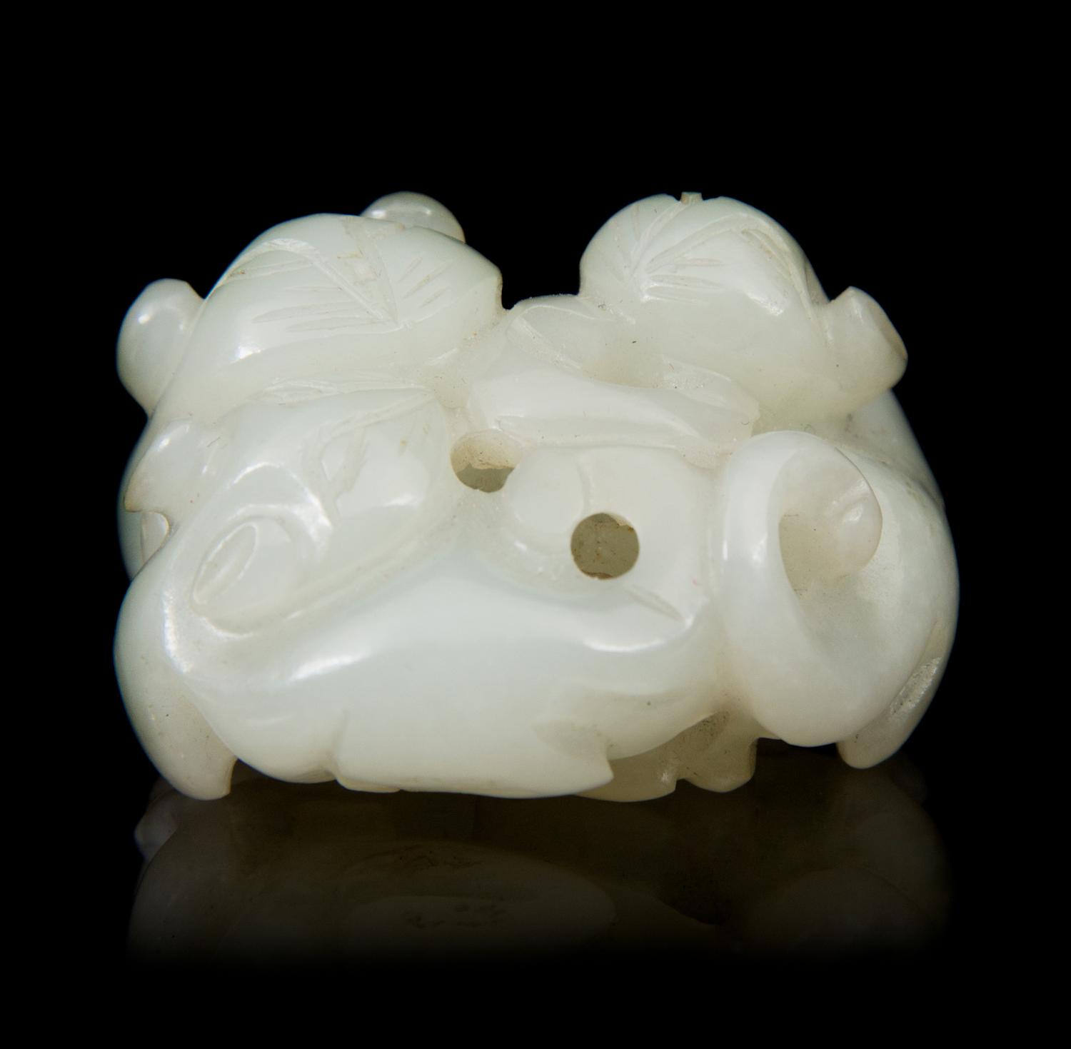 A Carved Jade Toggle Length 1 3/4 inches.
