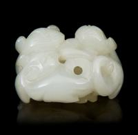 A Carved Jade Toggle Length 1 3/4 inches.