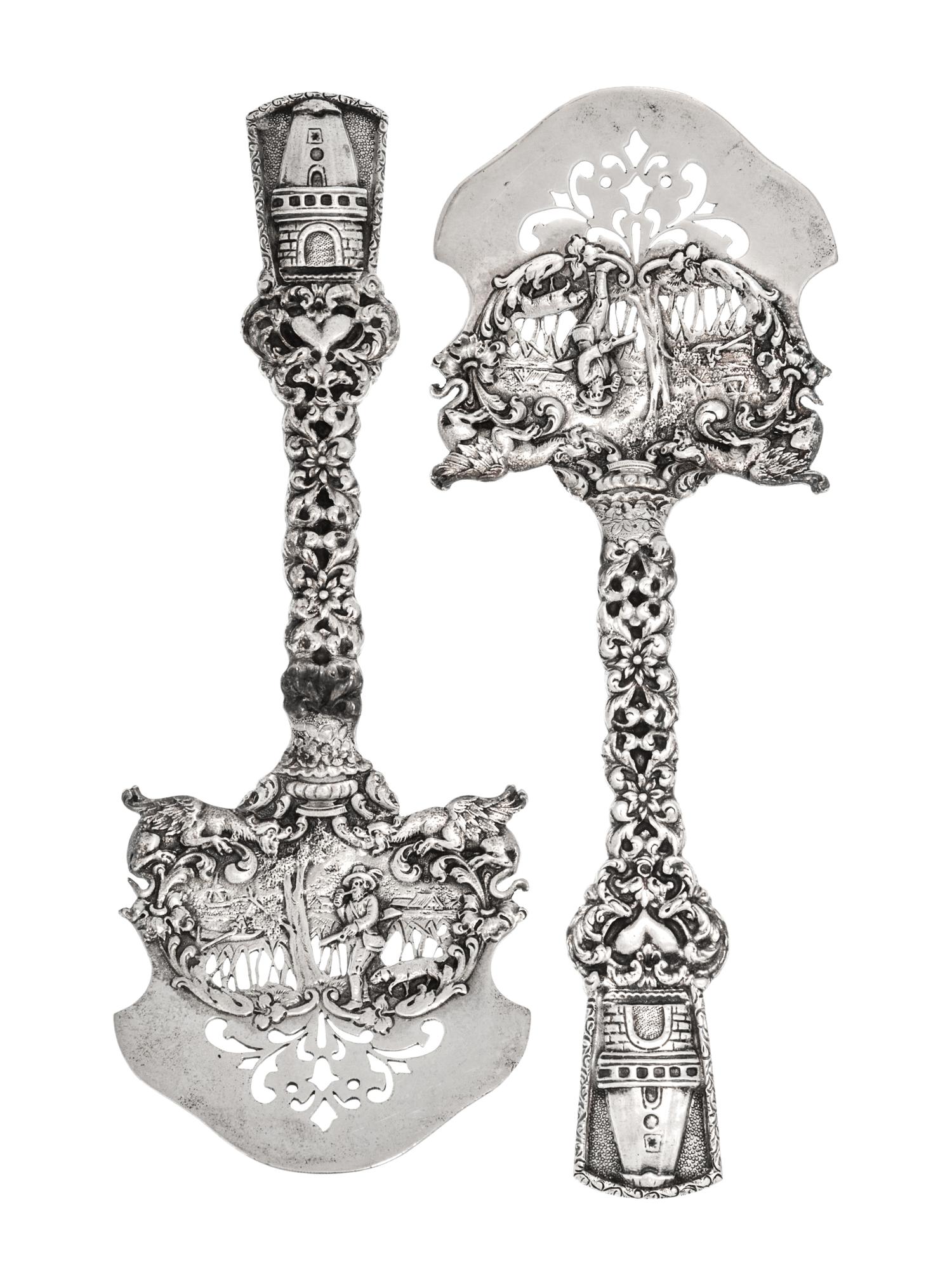 A Pair of American Silver Asparagus Servers, Marshall Field & Co., Chicago, IL, the openwork blade decorated with a hunter and dog in a