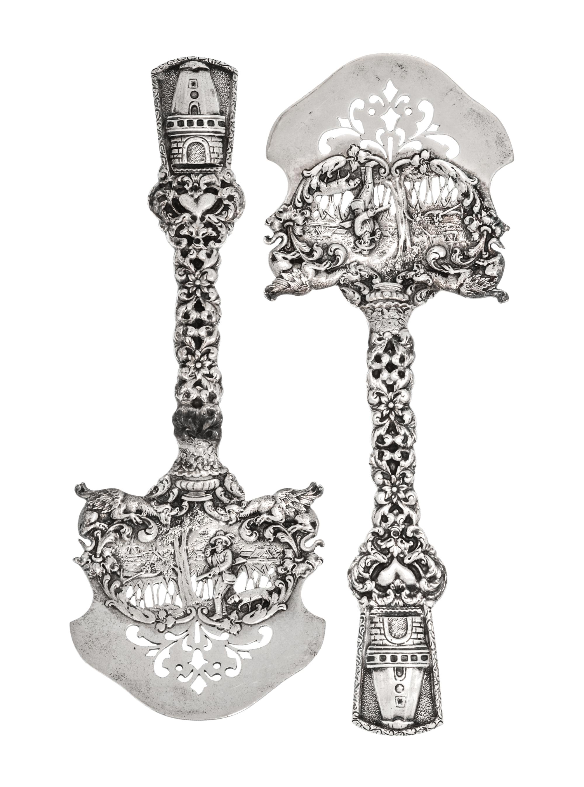 A Pair of American Silver Asparagus Servers, Marshall Field & Co., Chicago, IL, the openwork blade decorated with a hunter and dog in a