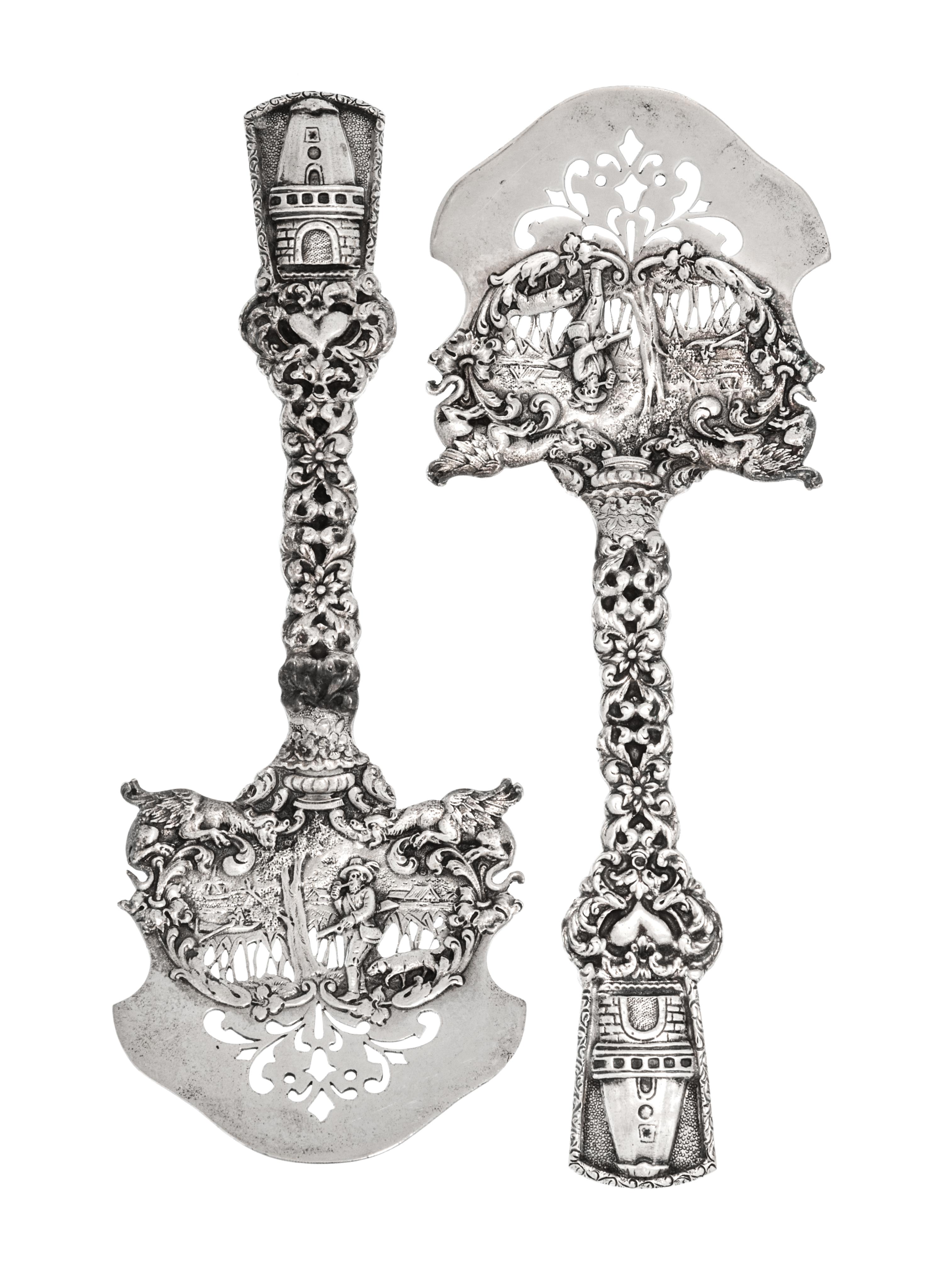 A Pair of American Silver Asparagus Servers, Marshall Field & Co., Chicago, IL, the openwork blade decorated with a hunter and dog in a