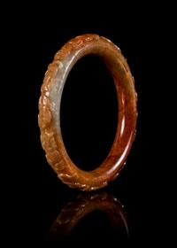 A Russet Jadeite Bangle Diameter 3 1/2 inches.