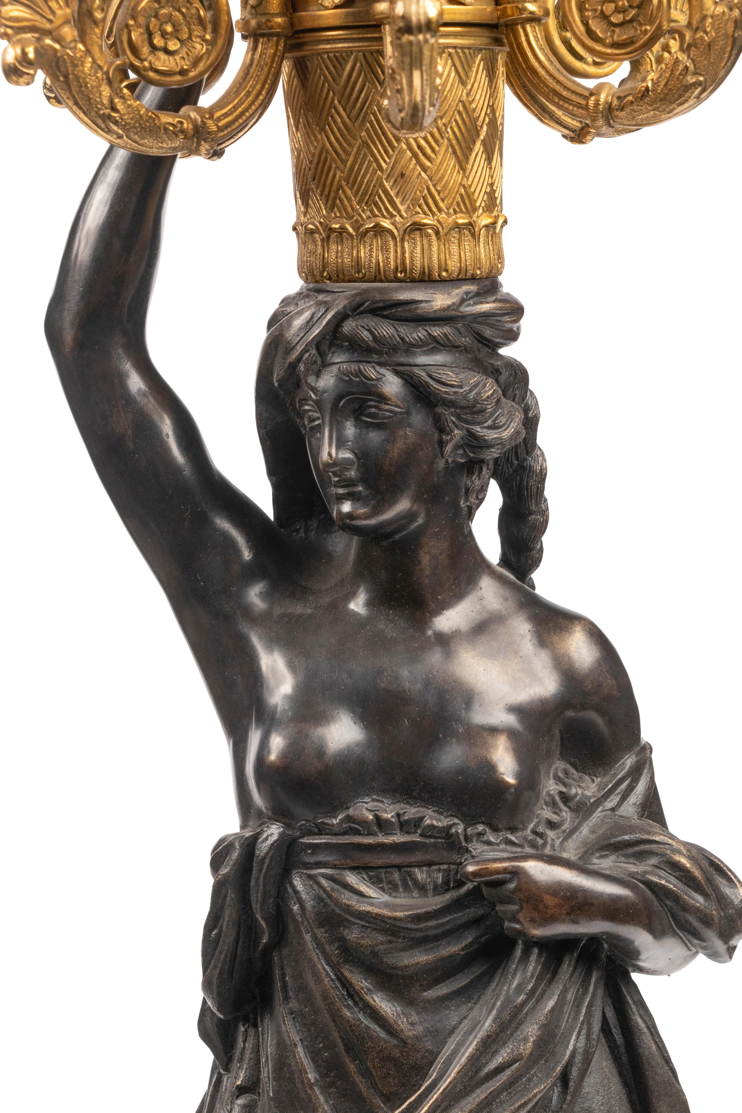 A Large French Gilt and Patinated Bronze and Rouge Marble Three-Piece Clock Garniture