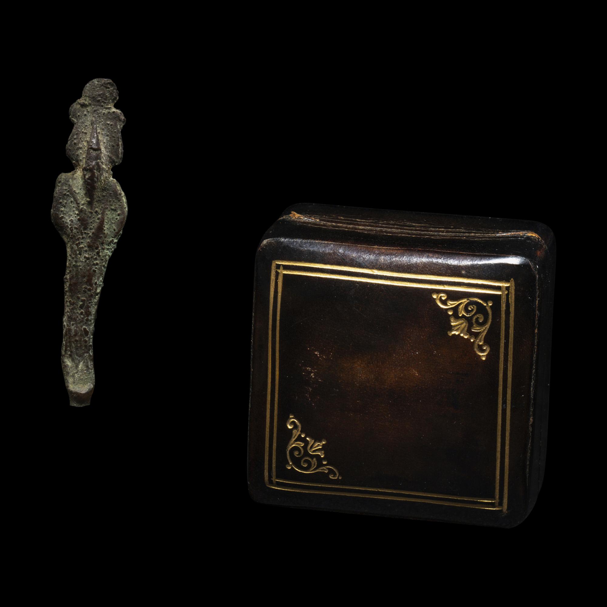An Egyptian Bronze Osiris, an Egyptian Faience Shu, and an Egyptian Faience Scarab
