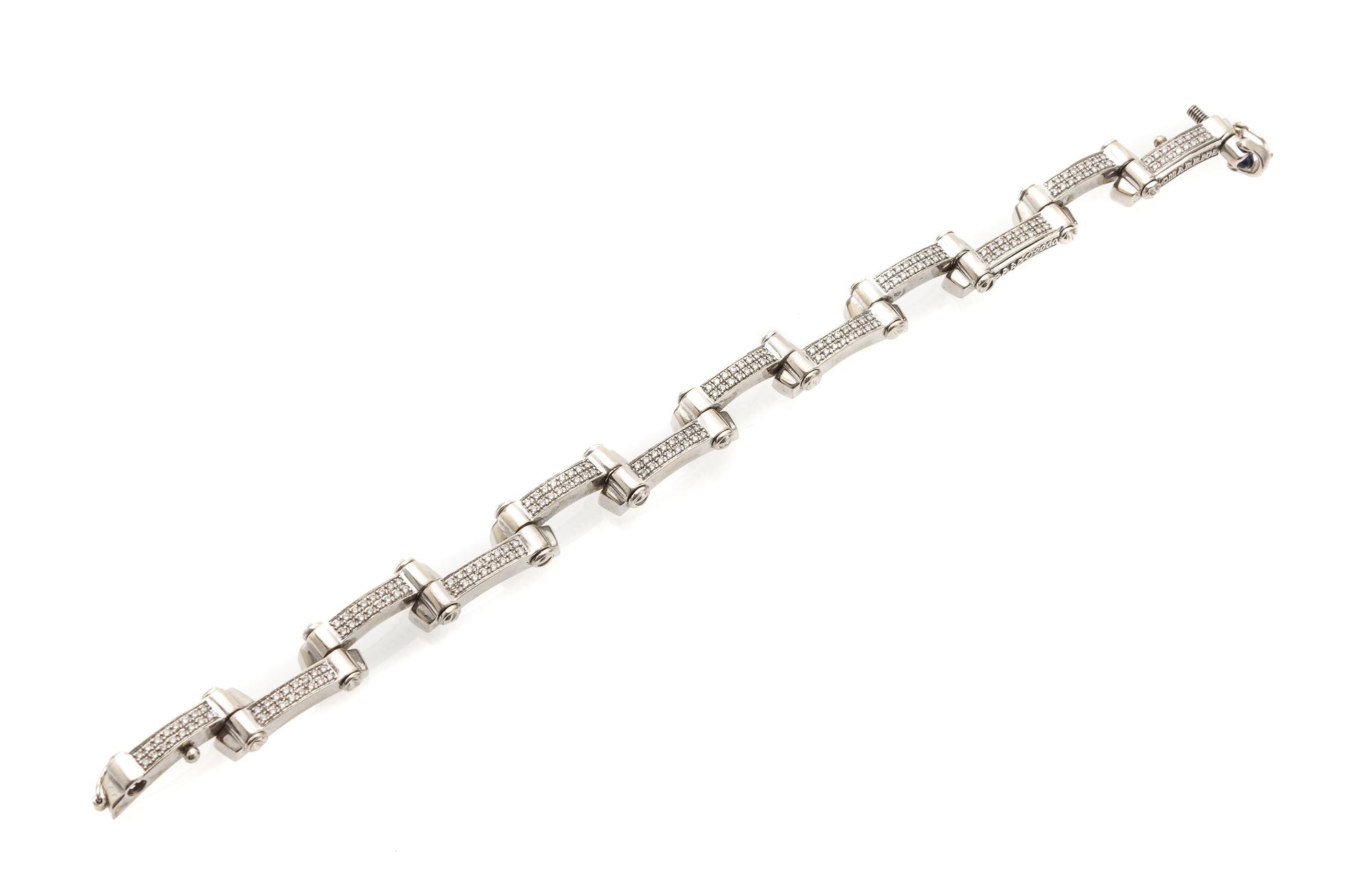 An 18 Karat White Gold, Diamond and Sapphire Bracelet, Charriol, 25.30 dwts.