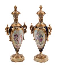 A Pair of Gilt Bronze Mounted Sèvres Style Porcelain, Onyx and Champlevé Urns