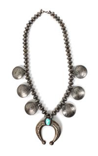 A Southwestern Silver Coin Necklace Length 25 inches; naja 3 x 3 5/8 inches.