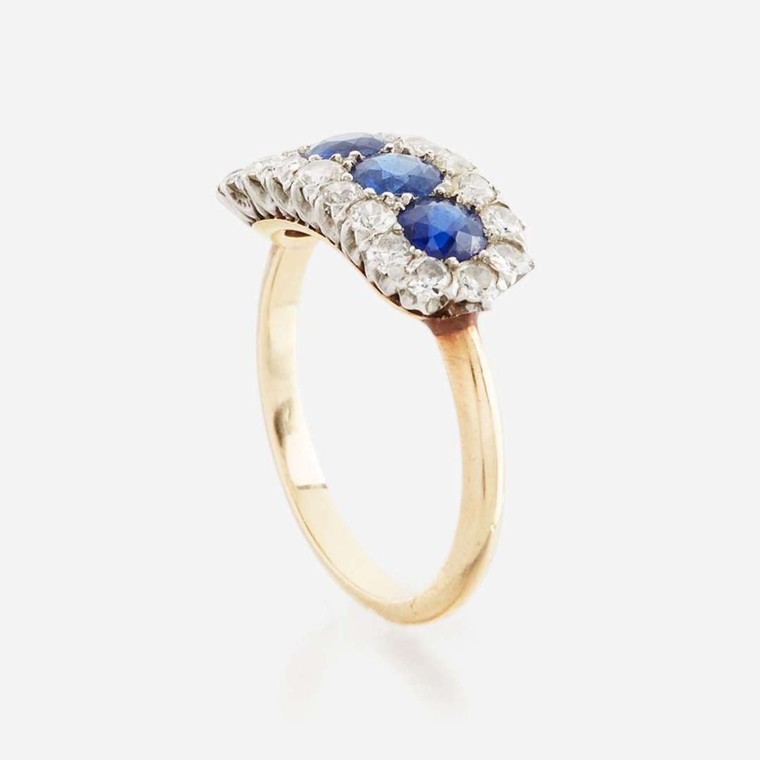 A sapphire, diamond, and gold ring