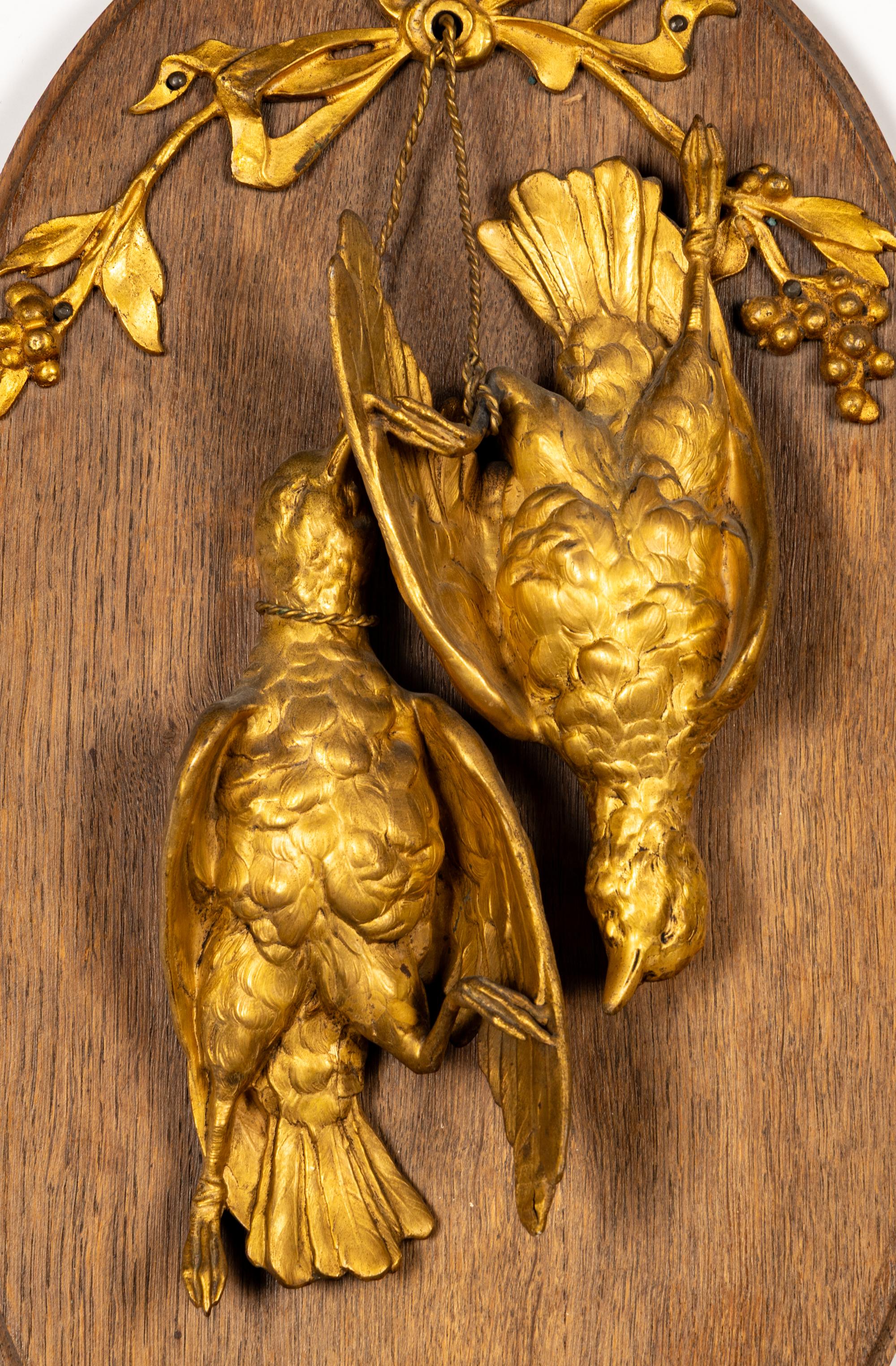 A Pair of Gilt Bronze and Walnut Hunt Plaques
