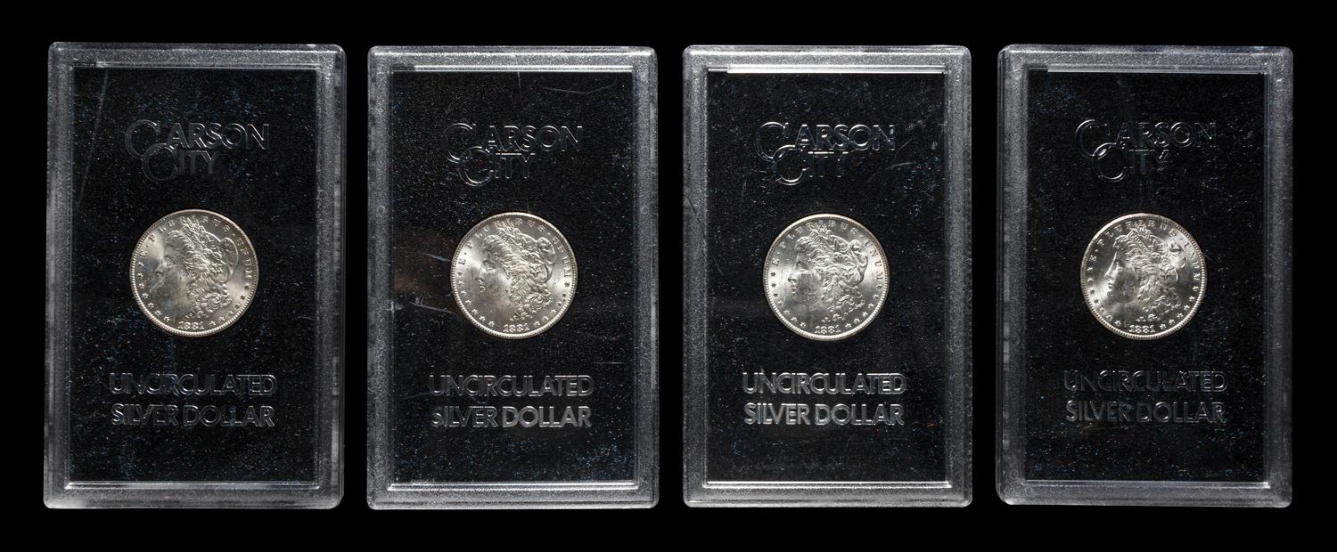 A Group of Four 1881-CC GSA: Morgan $1 Coins
