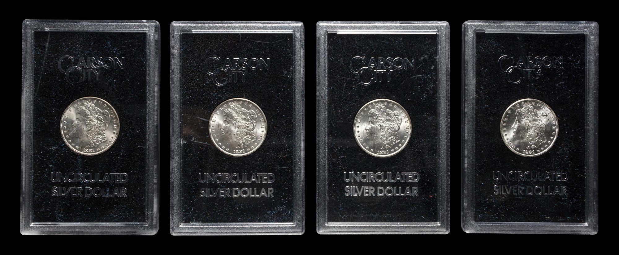 A Group of Four 1881-CC GSA: Morgan $1 Coins