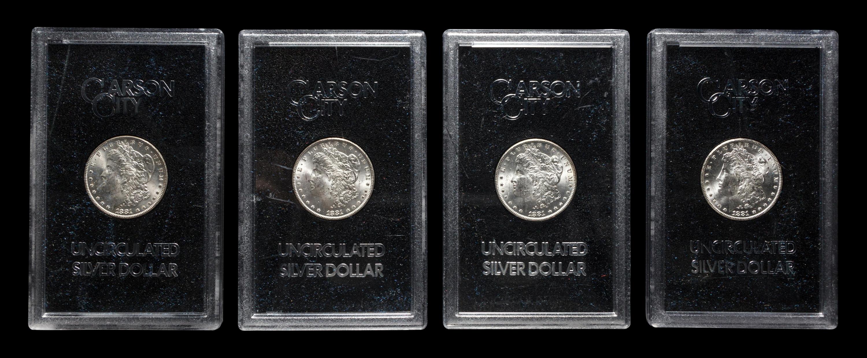 A Group of Four 1881-CC GSA: Morgan $1 Coins