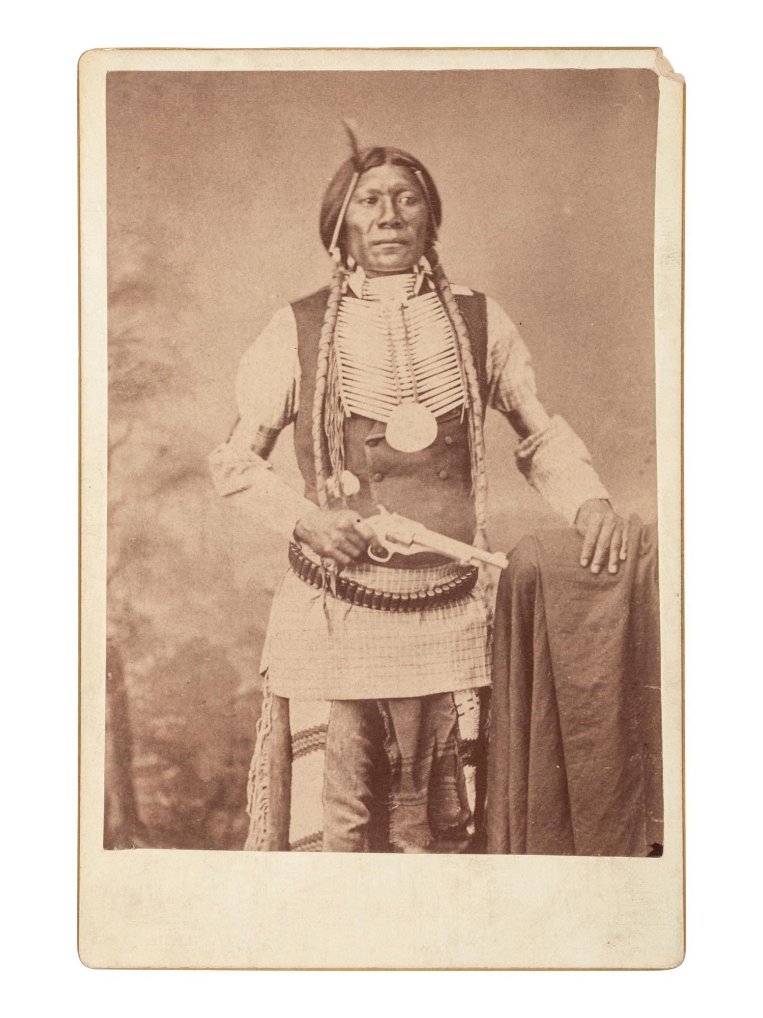 [NATIVE AMERICANS]. Cabinet card of "Big Jim" posed with a Forehand and Wadsworth Army revolver.