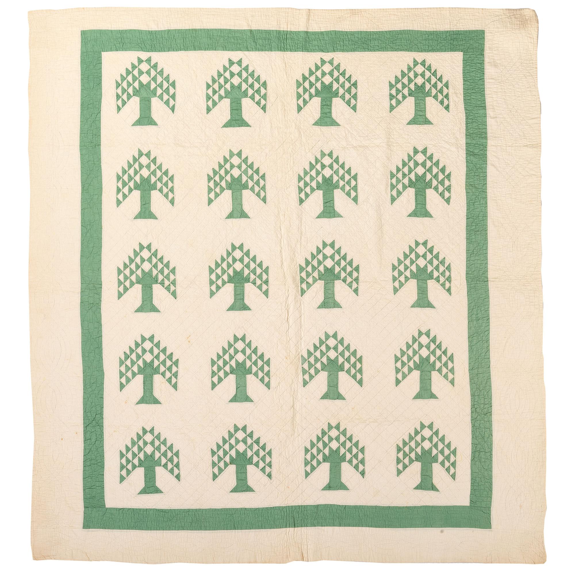 A Green and White Tree of Life Quilt