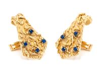 A Pair of 14 Karat Yellow Gold and Sapphire Cufflinks, 13.20 dwts.