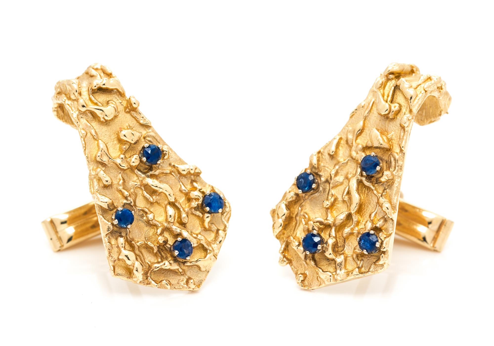 A Pair of 14 Karat Yellow Gold and Sapphire Cufflinks, 13.20 dwts.