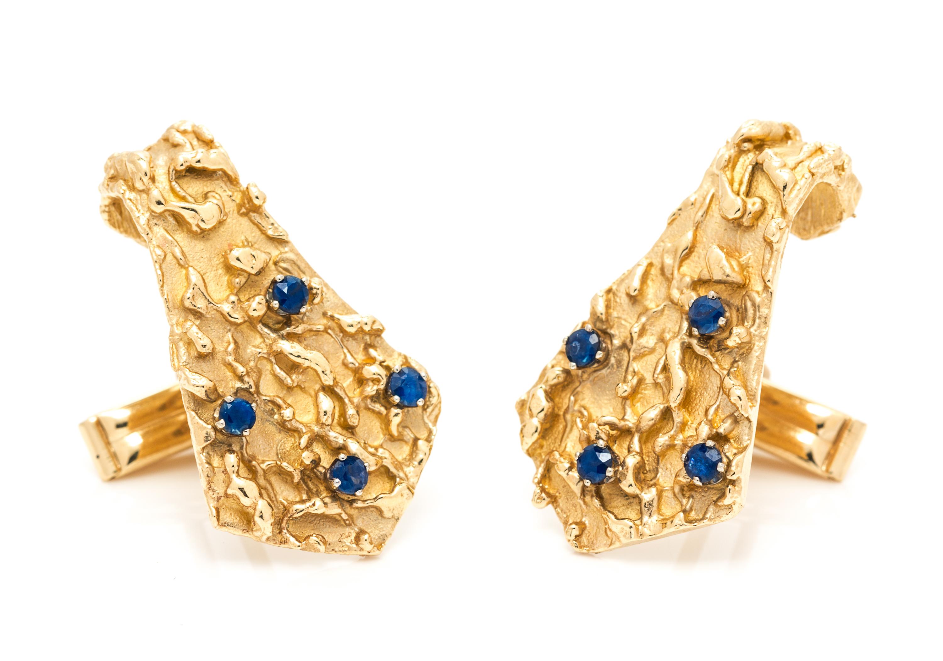 A Pair of 14 Karat Yellow Gold and Sapphire Cufflinks, 13.20 dwts.