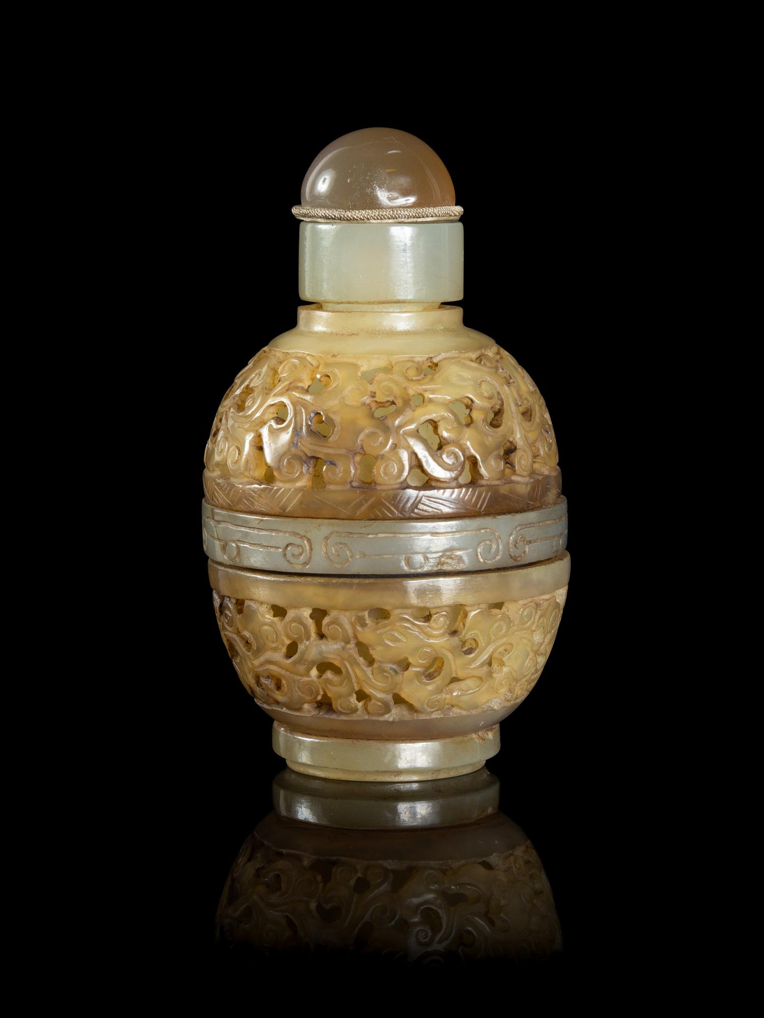 A Chinese Carved Celadon Jade Snuff Bottle