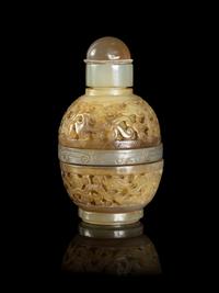A Chinese Carved Celadon Jade Snuff Bottle