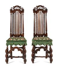 A Pair of William and Mary Style Carved Walnut Side Chairs
