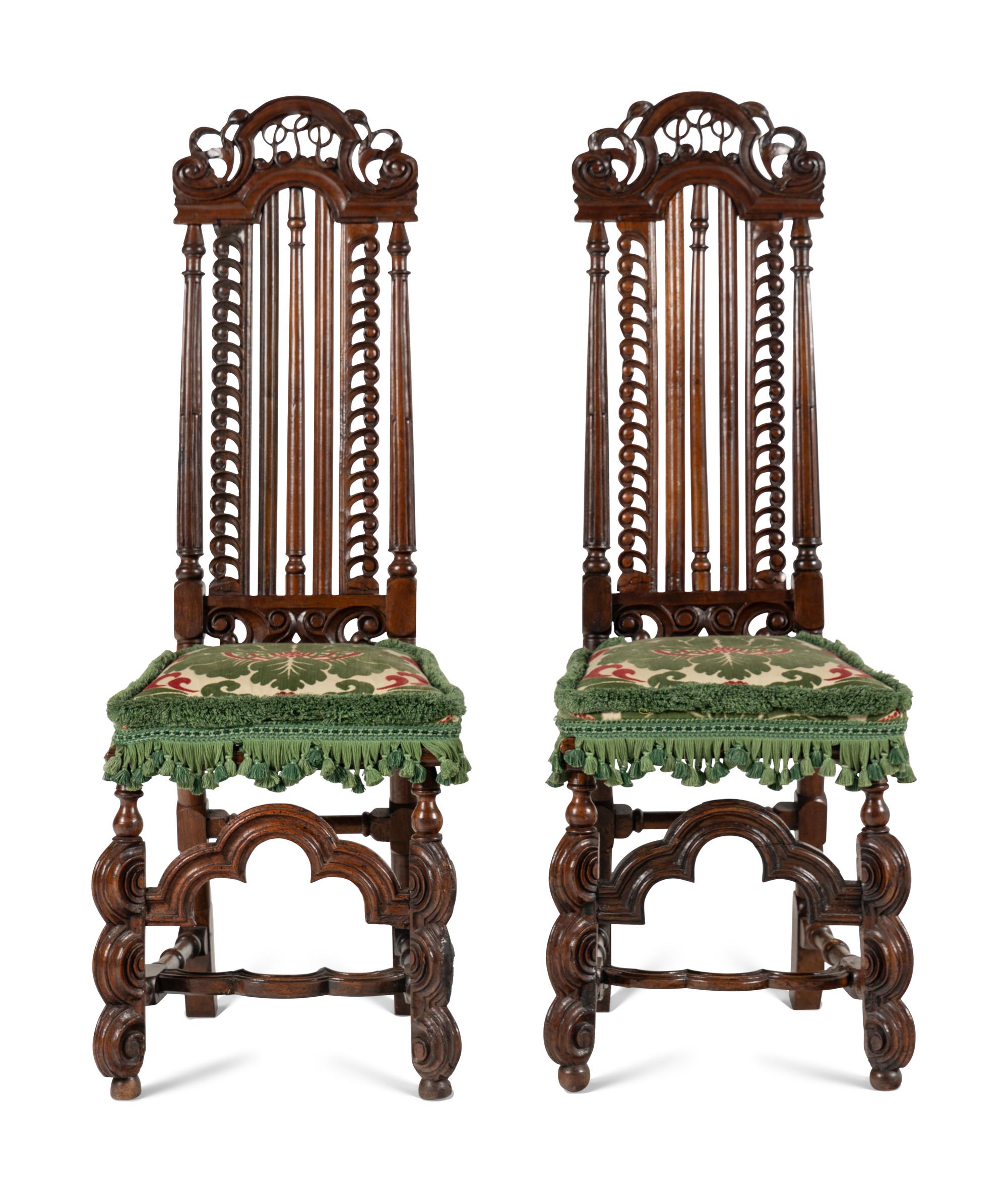 A Pair of William and Mary Style Carved Walnut Side Chairs