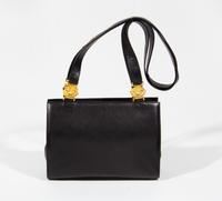 A Gianni Versace Black Leather Medusa Shoulder Bag, 11.75" x 8.5" x 3.5"; Strap drop: 19.5".