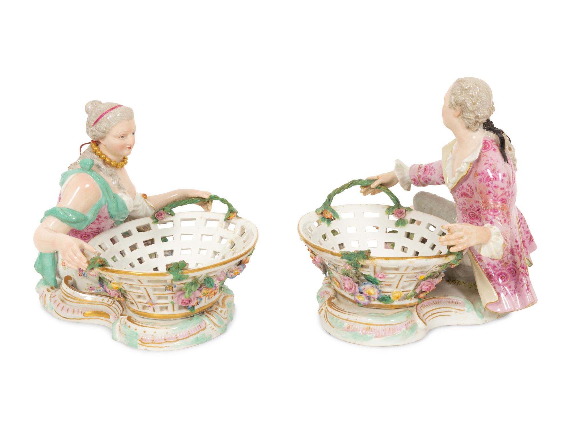 A Pair of German Porcelain Figural Sweetmeat Baskets