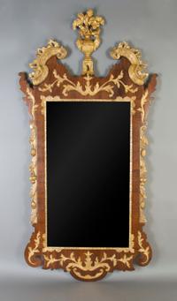 A George III Mahogany Parcel Gilt Mirror, Height 51 1/2 x width 26 inches.
