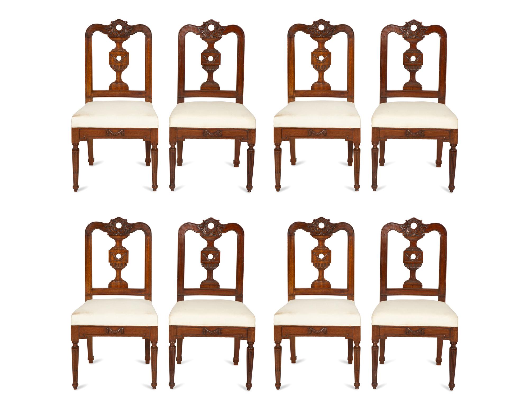 A Set of Eight Italian Walnut Dining Chairs
