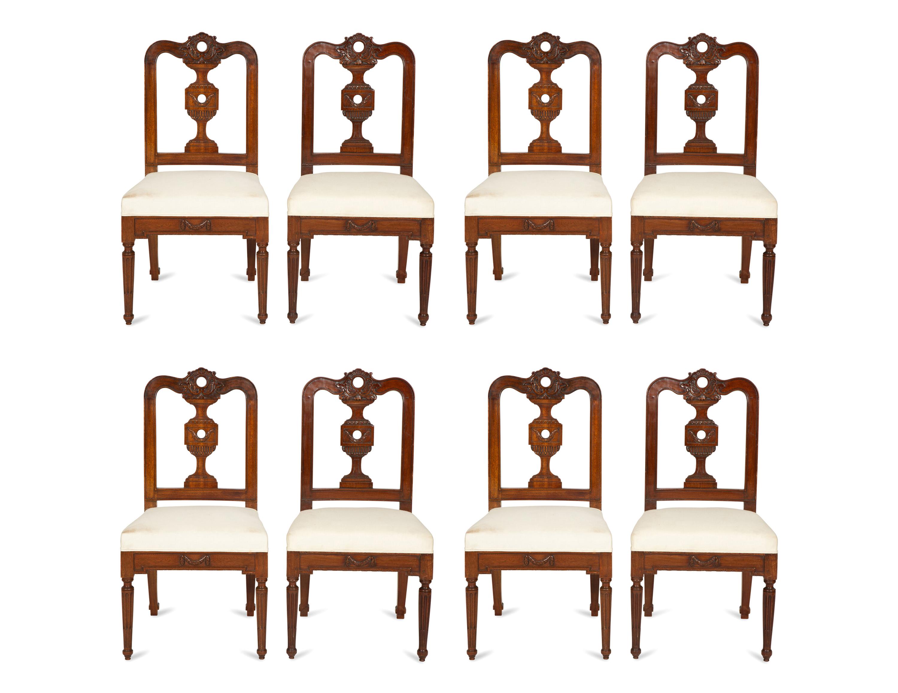 A Set of Eight Italian Walnut Dining Chairs